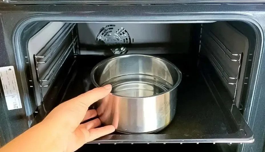 I fill the pan and put it in the oven. The dirt comes off the walls and the rack by itself.