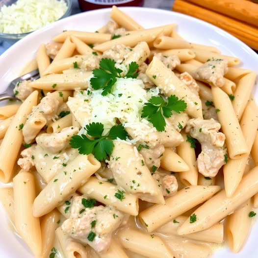 Tender chicken strips with creamy pasta in a creamy sauce