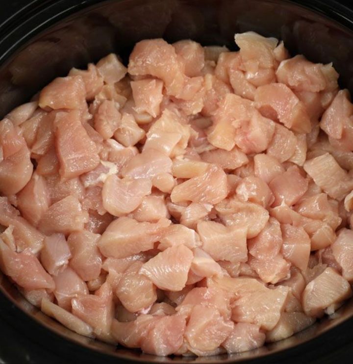 Put diced chicken and brown sugar into a slow cooker for this take-out favorite